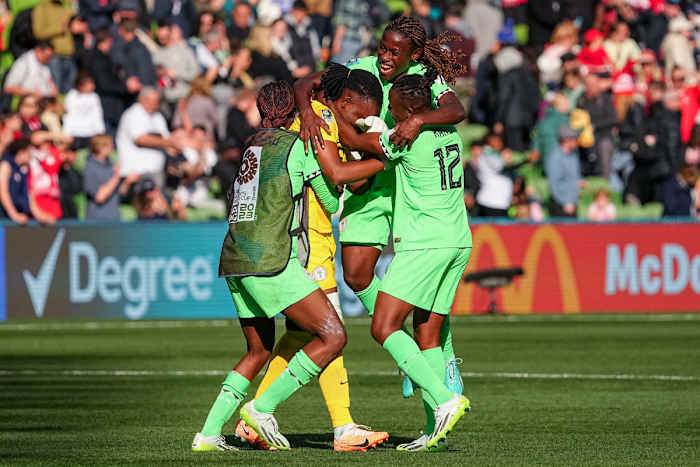 Nigeria players celebrate after finishing second in Group B at the Women's World Cup.